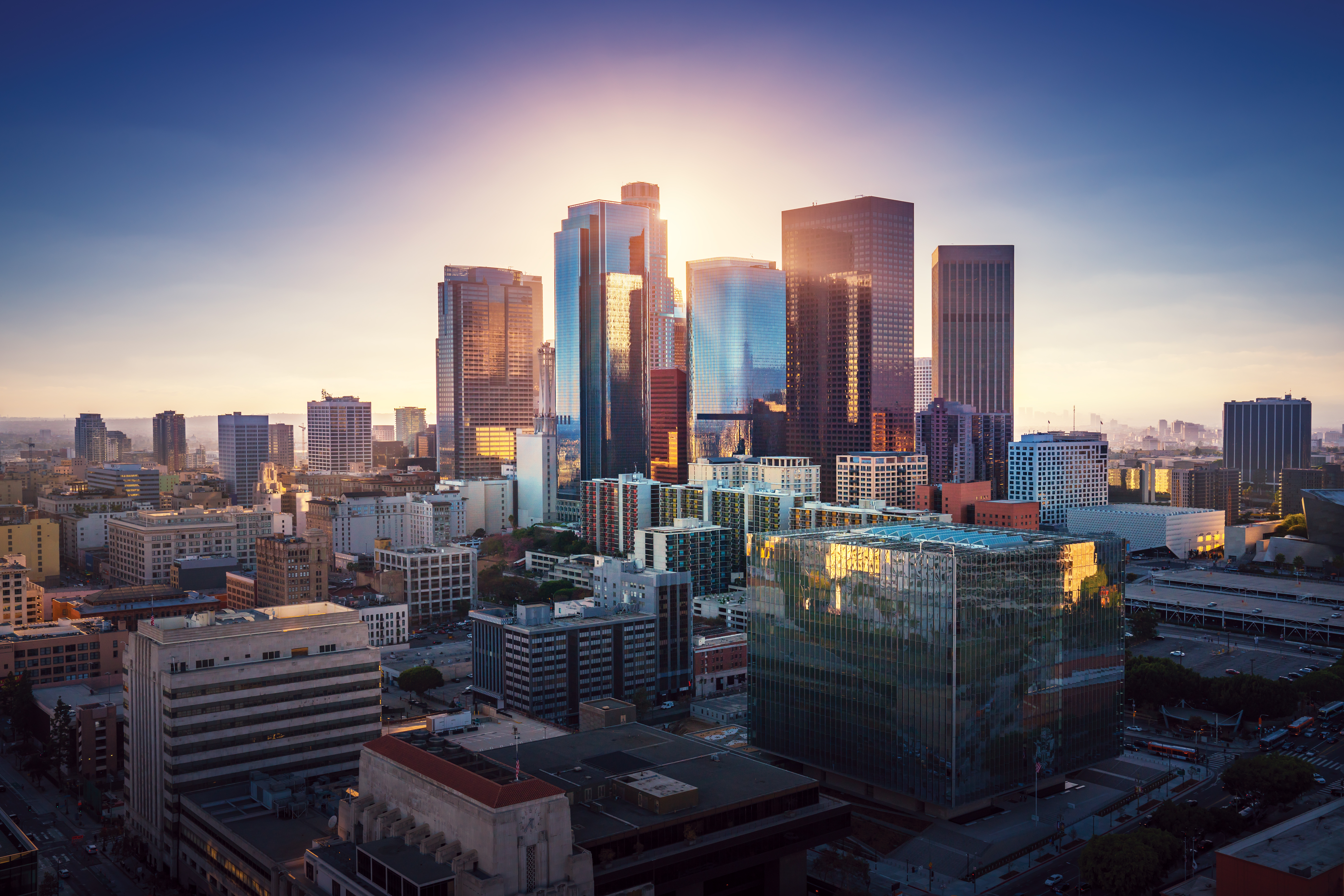 Sunset over Los Angeles downtown. Retro colors. California theme. LA background. Los Angeles city center.